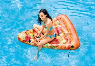 Large inflatable pizza surfboard recliner floating on water with bright multicolour design