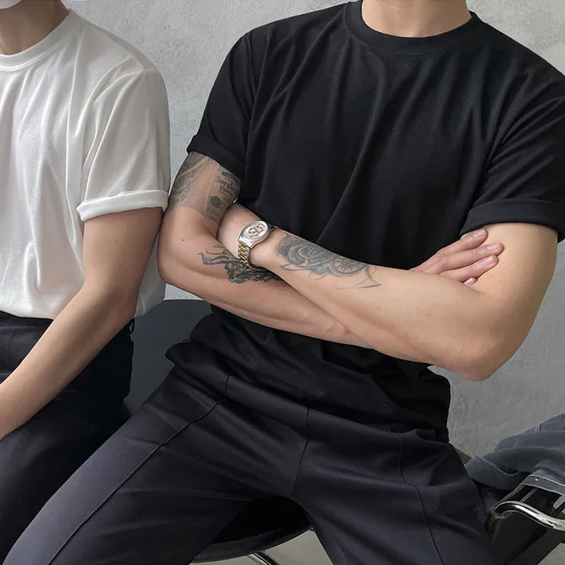 Men's slim-fit cotton T-shirt in solid white colour with half-length sleeves on a hanger.