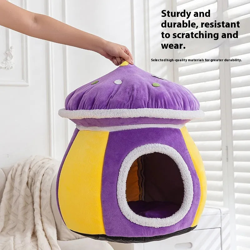 Grey mushroom-shaped plush cat bed on a wooden floor.