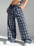 Women's loose fit plaid trousers with drawstring waistband and side pockets in blue colour
