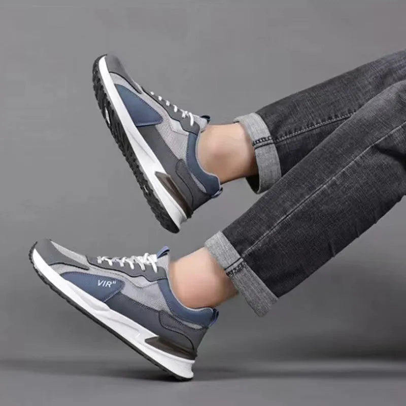 Men's low-top lace-up sneakers with colour block mesh upper and injection moulded sole.