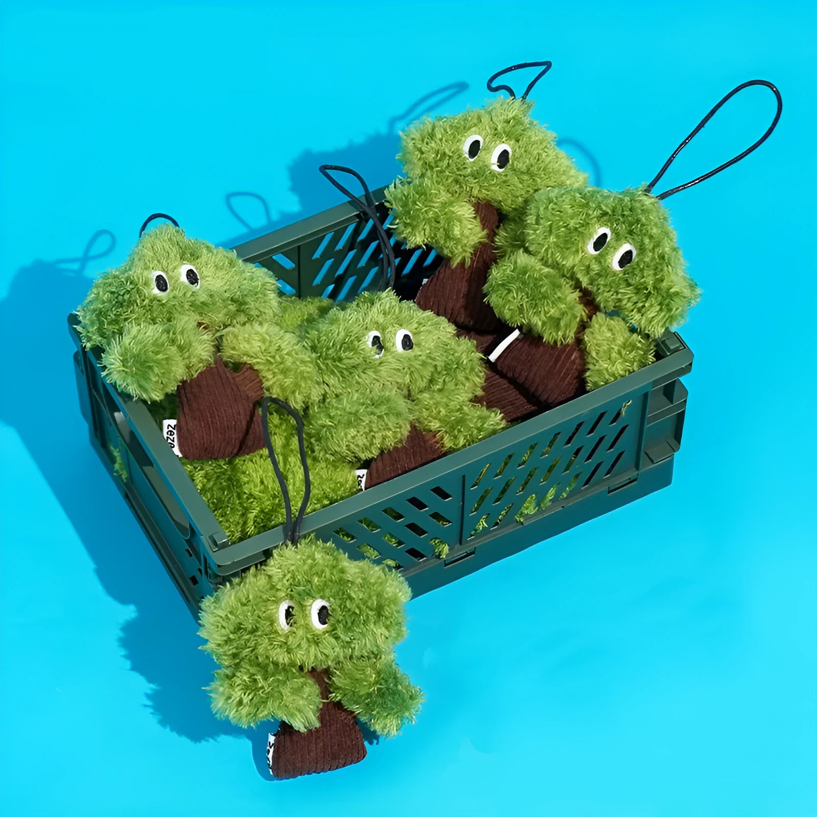 Pine tree shaped cat chew toy pendant that doubles as a tease stick.