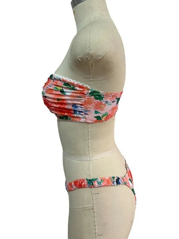 Women's floral print bikini set with lace trim on tube top and briefs in blue colour