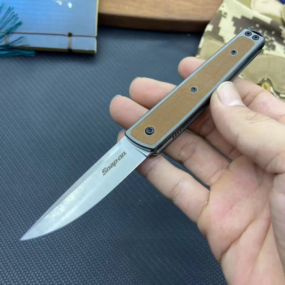 Folding fruit knife with stainless steel blade in black, coffee, or red colour measuring 17cm total length
