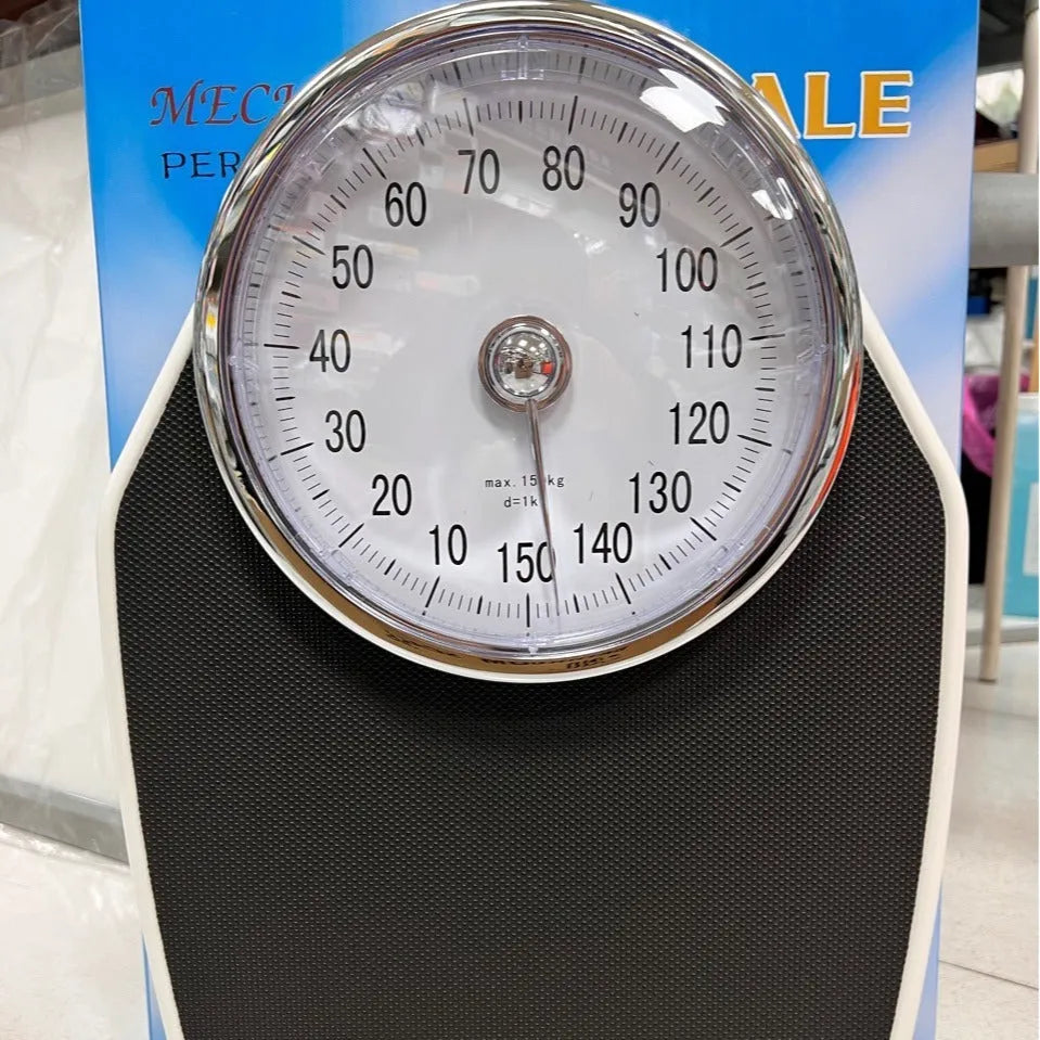 Black mechanical pointer body weight scale with large dial on a 47x35x11cm platform.