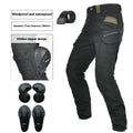 Men's black waterproof motorcycle pants with belt and protective gear set on a neutral background.