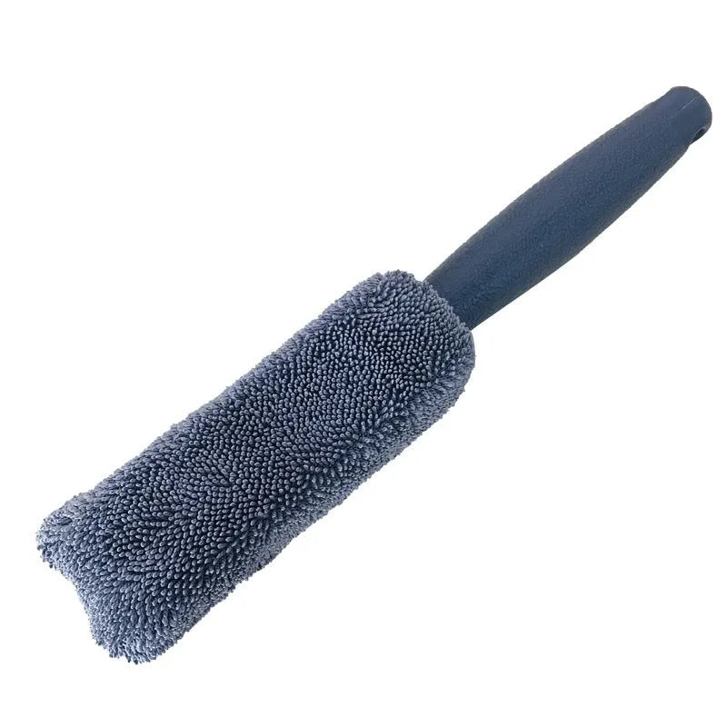 Blue long-handled microfiber brush for cleaning car tyres and wheels on a grey background.