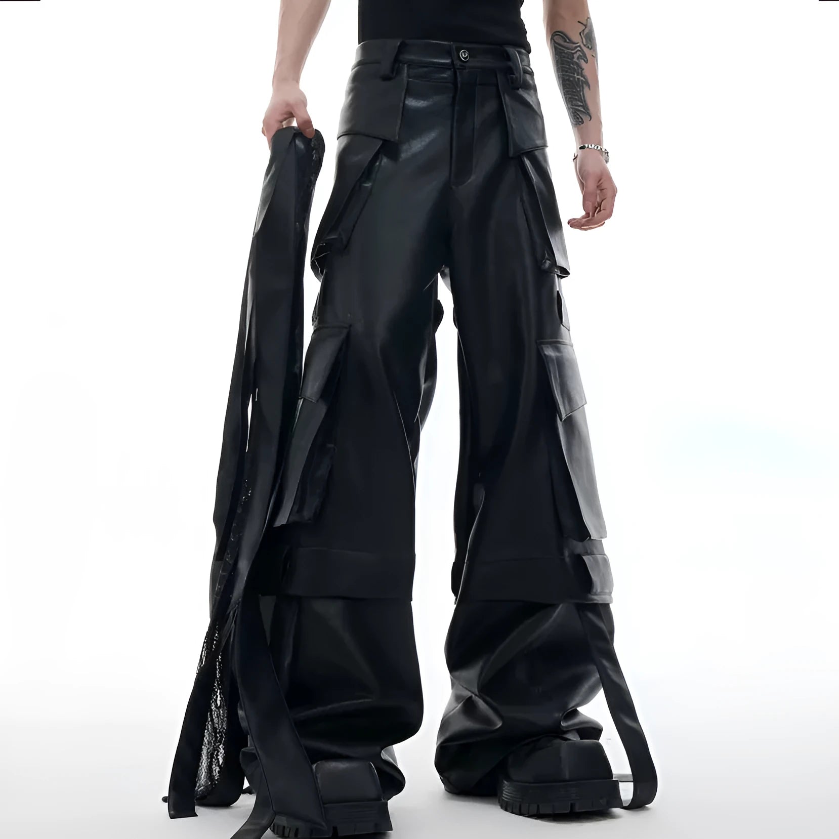 Black loose-fit retro leather pants with quilted panels and multiple pockets.