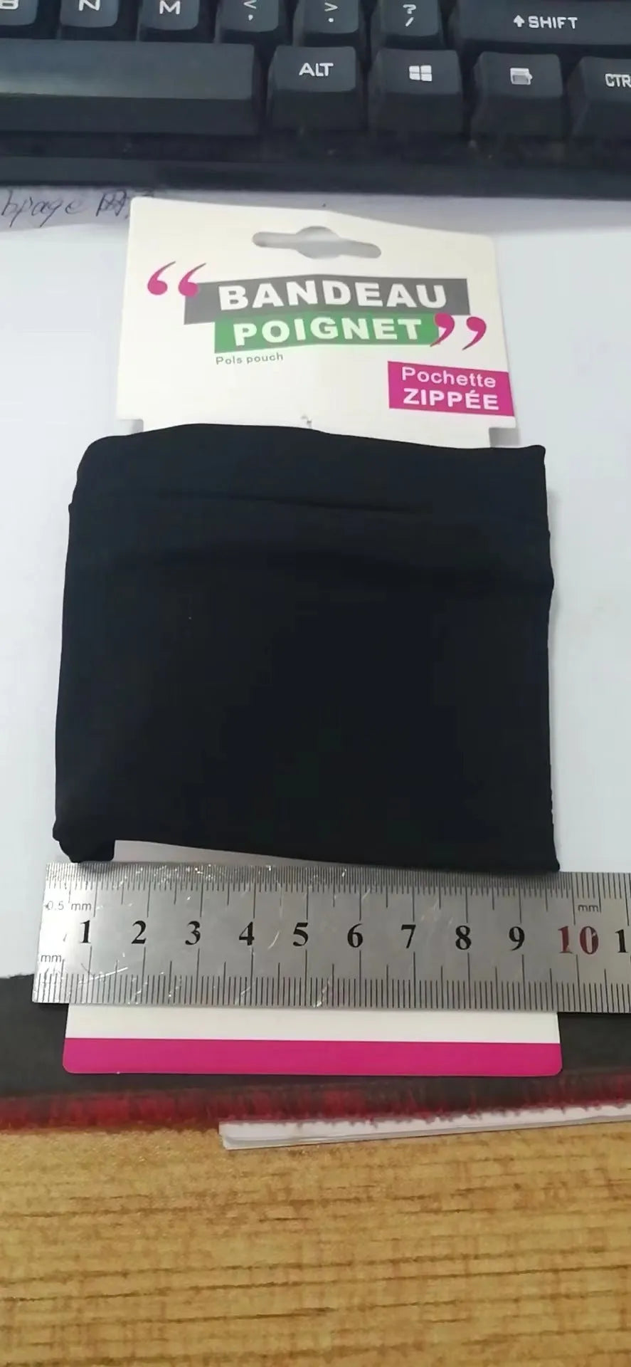 Grey wrist bag armband sleeve for mobile phone, shown with dimensions 10cm by 10.5cm.