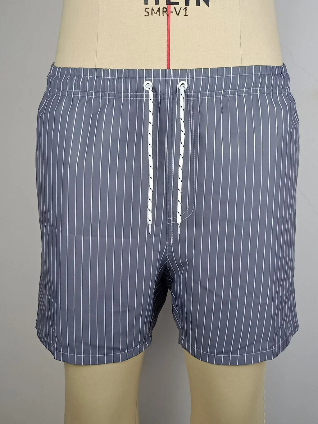 Men's striped beach shorts in navy blue, available in Asian sizes S to XXL with a straight-leg opening.