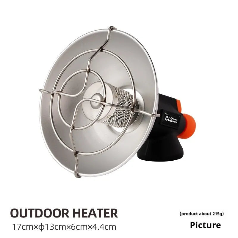 Black and orange mini portable outdoor heating stove with automatic ignition on a table.