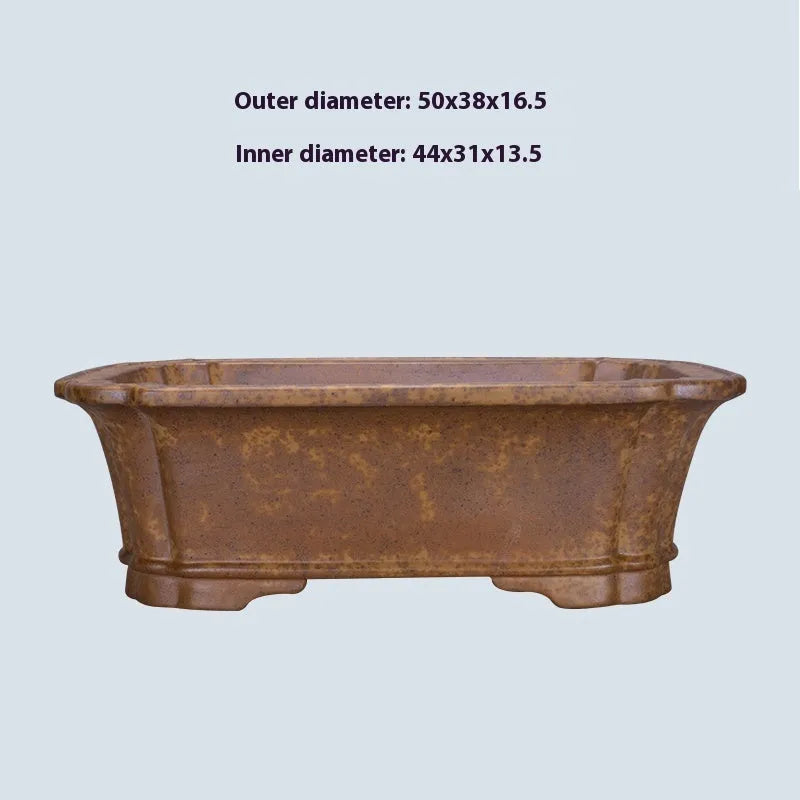 Purple sand rectangular flowerpot showing textured segment mud construction and geometric angles.