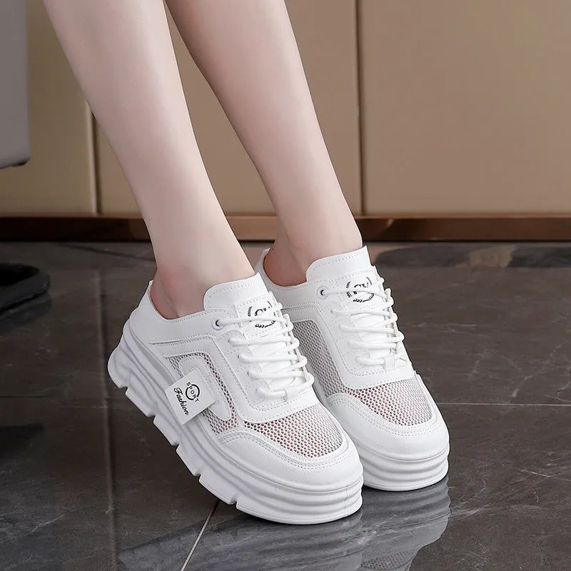 Women's black mesh half slippers with round toe and rubber sole on a white background