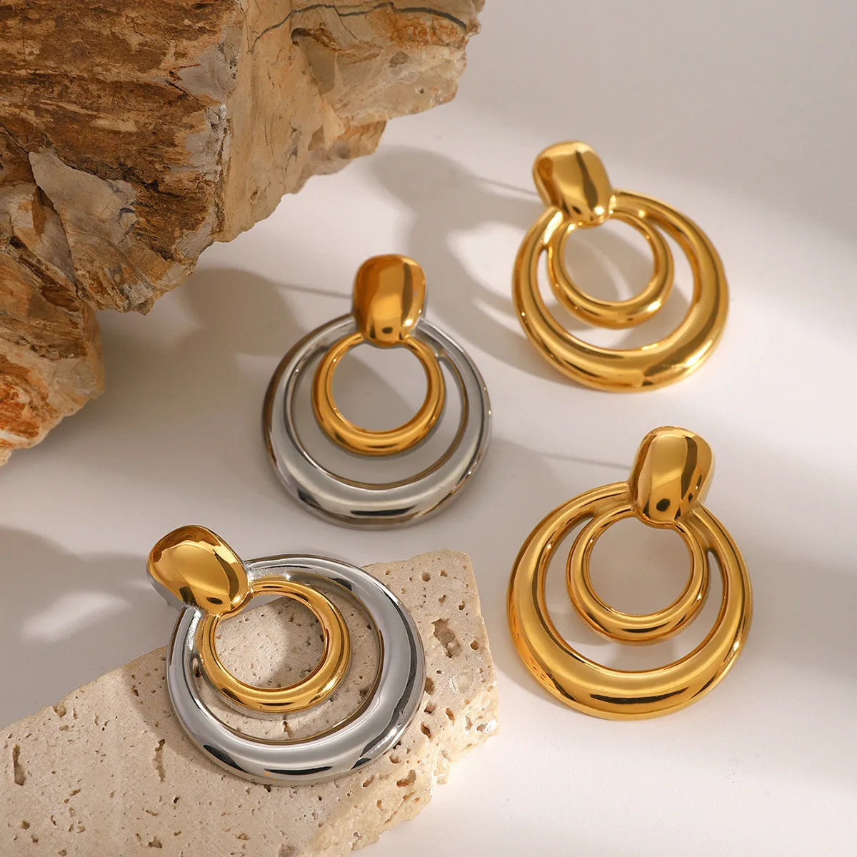 Golden round double layer hollow stud earrings with geometric design