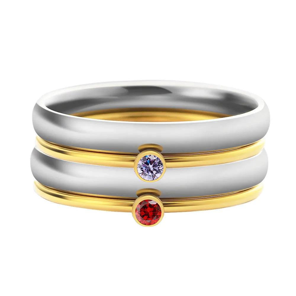 Titanium steel December birthstone ring with electroplated finish, engraved geometry shape, and gold handle.