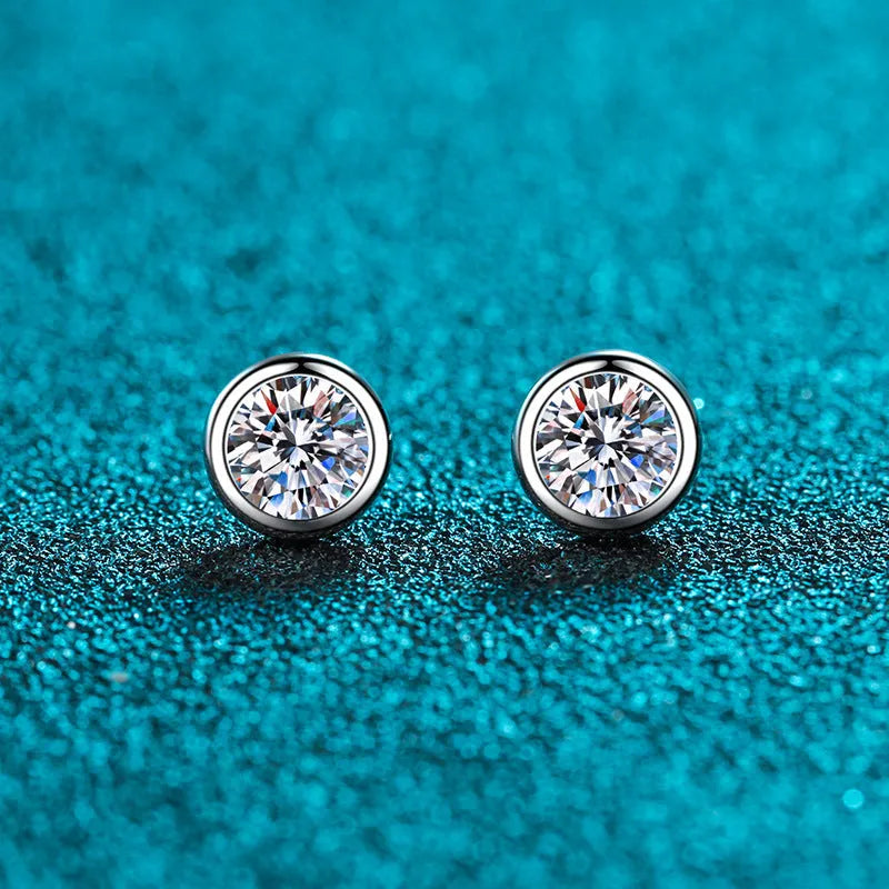 Pair of 925 sterling silver gold plated stud earrings featuring geometric moissanite or zircon stones in golden toad or star shape.