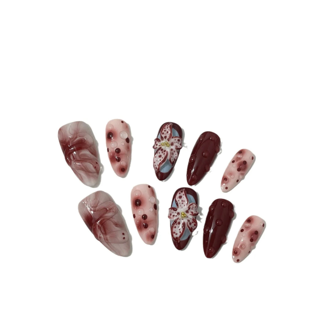 Hand-painted three-dimensional carved press-on nails with almond shape showing rose and tulip floral designs