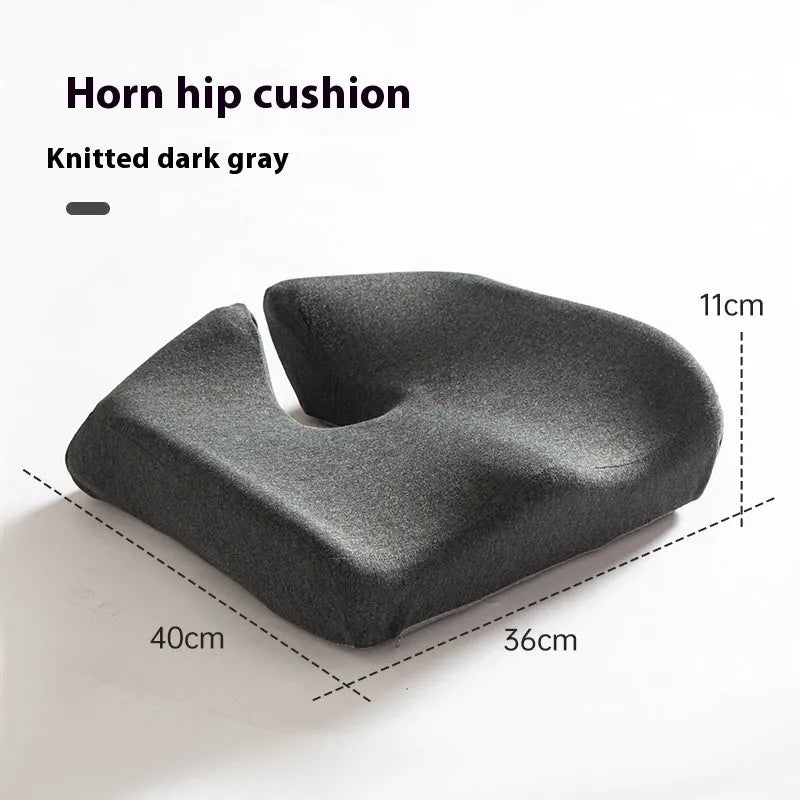 Dark grey memory foam office chair cushion measuring 36x40cm on a desk chair.