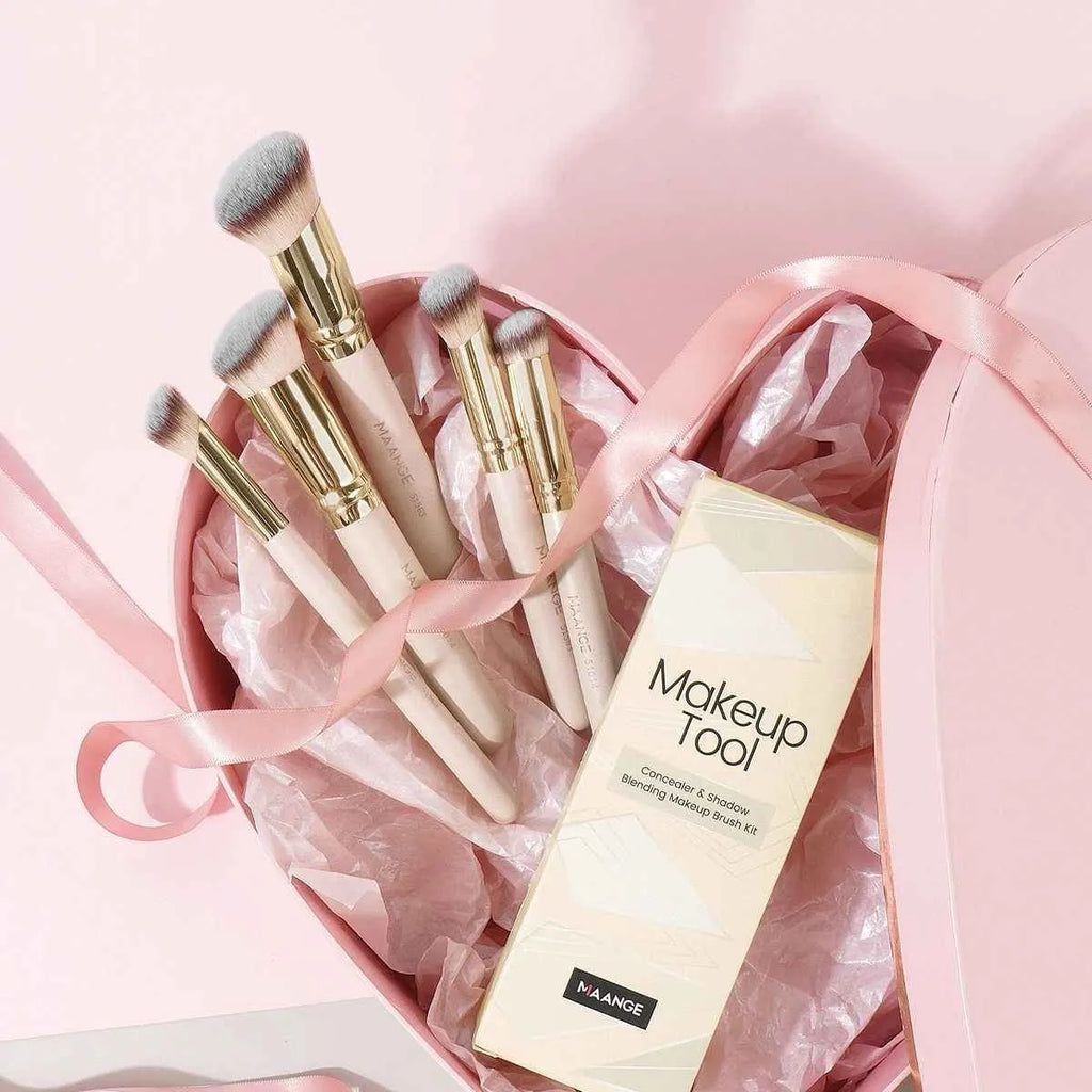 MAANGE apricot coloured five-piece angled blush and kabuki makeup brush set.