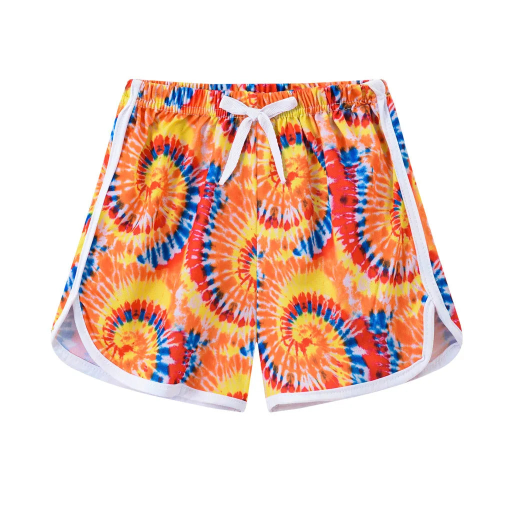 Children's polyester beach shorts in various colors and patterns including pineapple and kitten designs for sizes 100 to 140