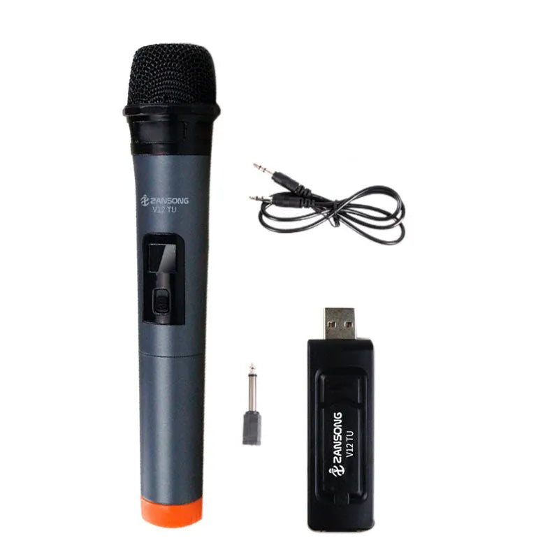 Black ZANSONG V12 dynamic wireless microphone with USB receiver and cables on a table.