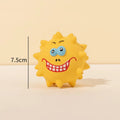 Set of four coloured squeaky dog balls with animal faces and bumpy texture