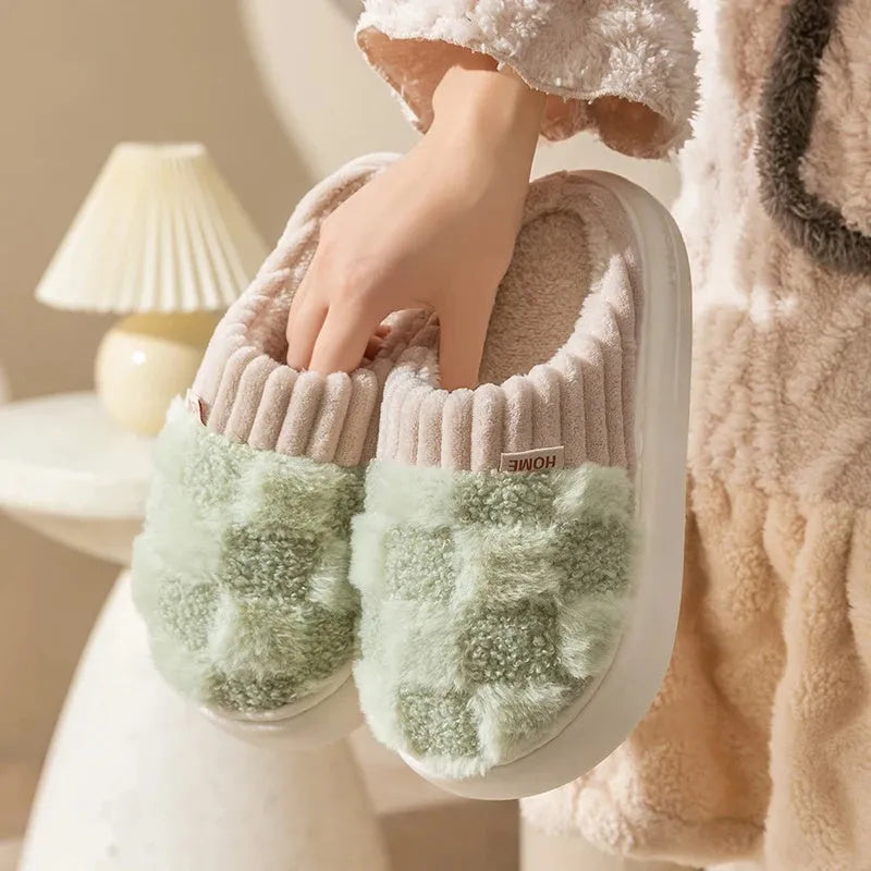 Women's plaid patterned plush slippers with coral velvet upper and non-slip PVC sole in coffee colour.