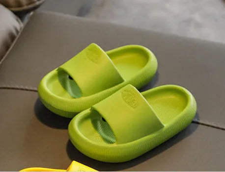 Colourful children's EVA slippers with a thick, textured non-slip sole in various sizes.
