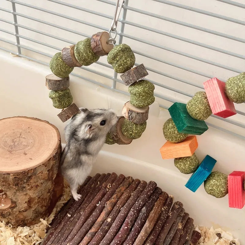 Hamster toy with straw ball ring and applewood chew rod for small pets