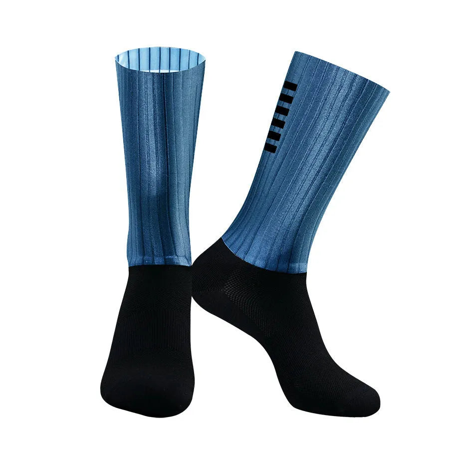 A pair of athletic cycling and running socks in a moisture-wicking fabric blend on a grey background.