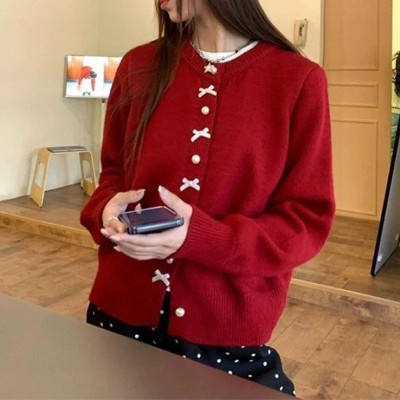 Women's solid colour sweater cardigan with bow detail and pearl buttons