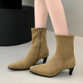Brown women's square toe ankle boots with a side zip and a mid-height stiletto heel.