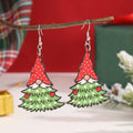 Wooden Christmas earrings with geometric shapes and printed Santa Claus holiday designs