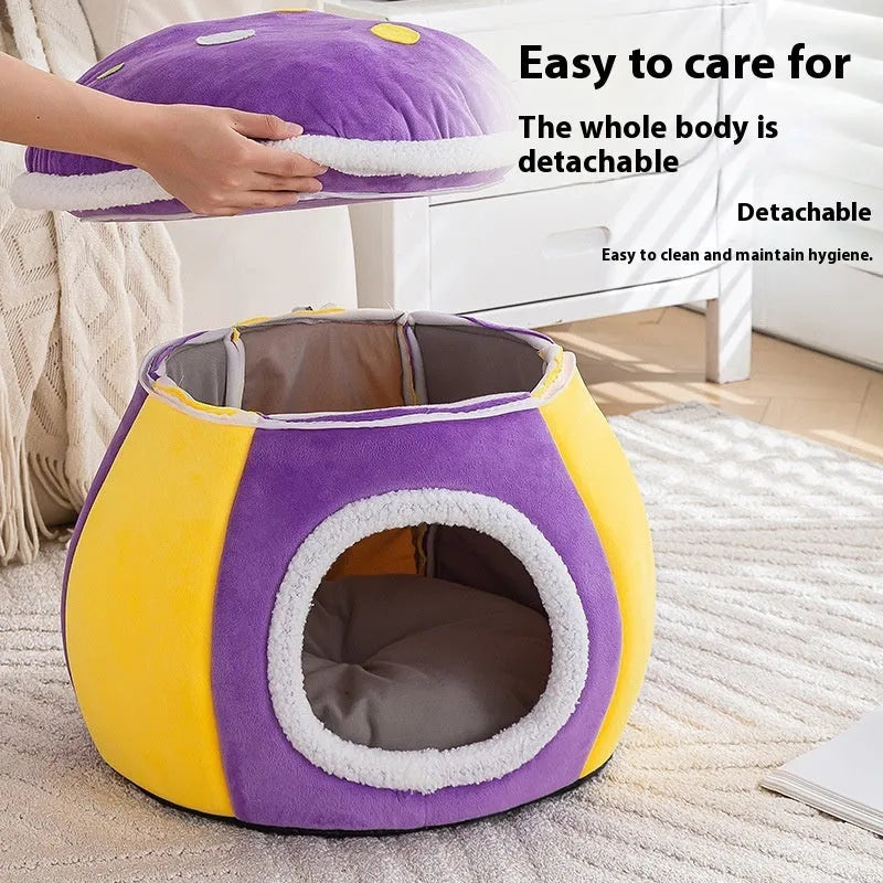 Grey mushroom-shaped plush cat bed on a wooden floor.