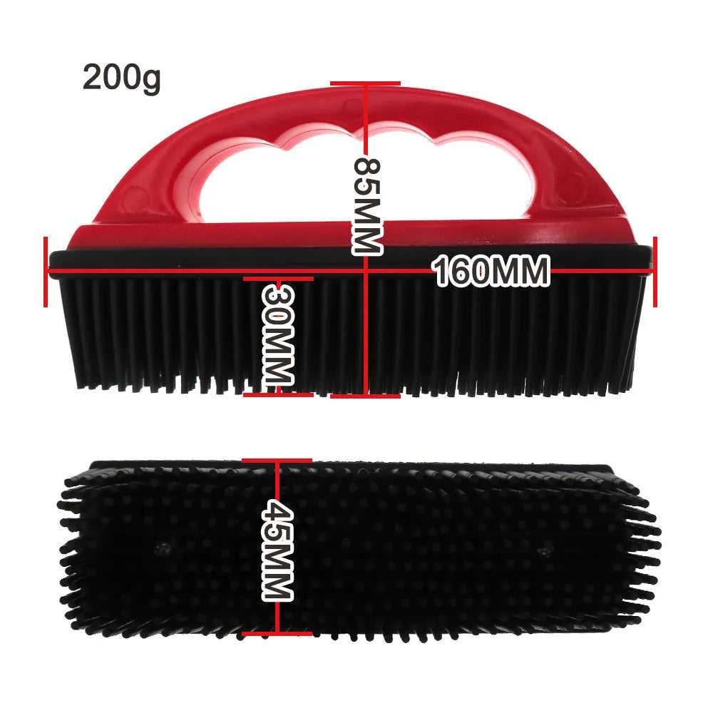Red handheld pet hair removal brush with rubber bristles for grooming dogs and cleaning carpets.