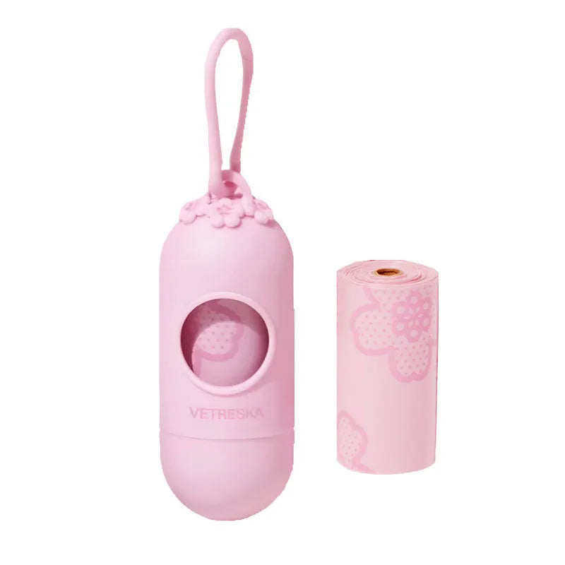 Dog poo bag dispenser capsule with strawberry pattern and roll of 15 biodegradable scented bags