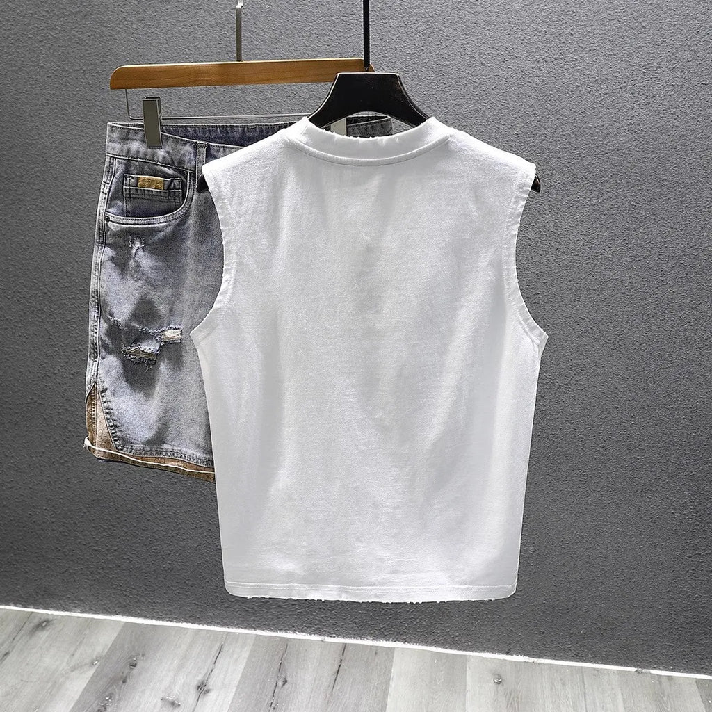 A man's solid black cotton sleeveless t-shirt with a loose fit and straight hem, laid flat.