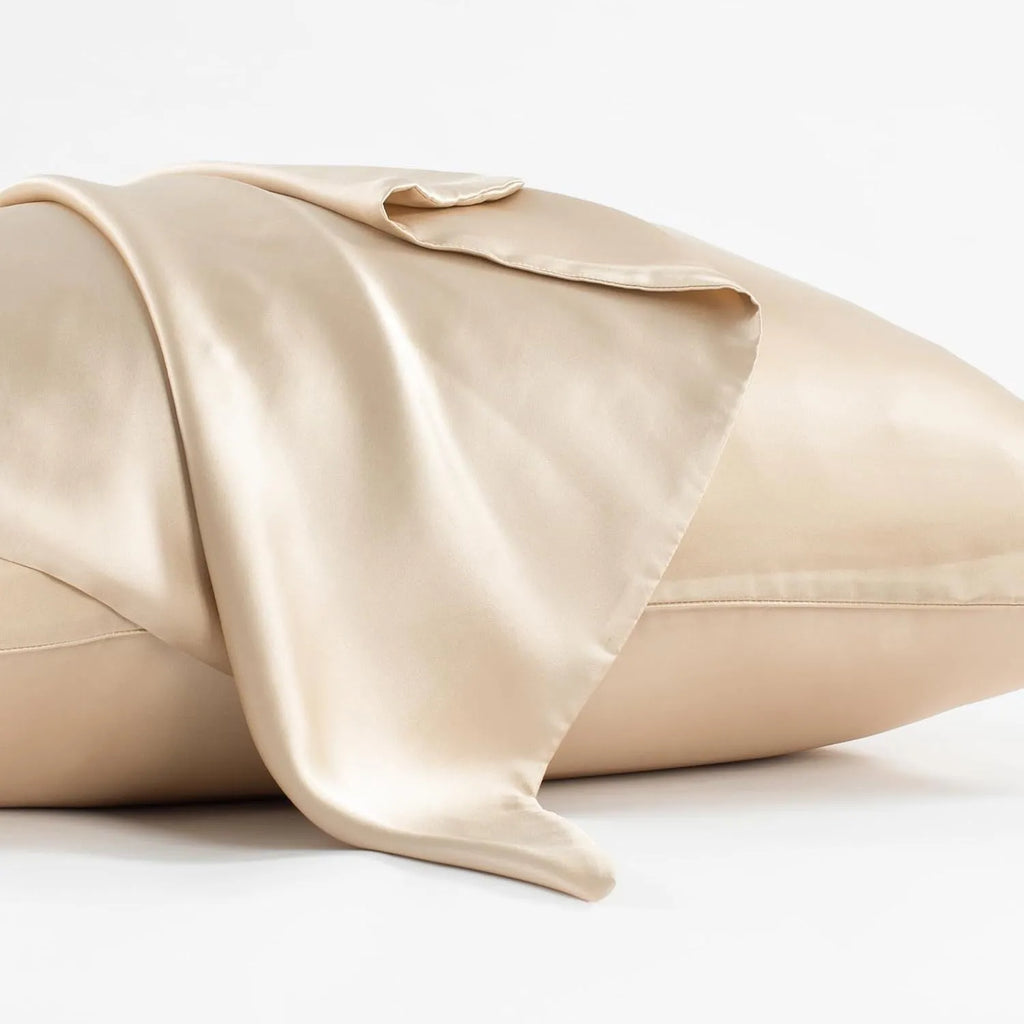 Solid colour mulberry silk envelope pillowcase in dark grey on a bed