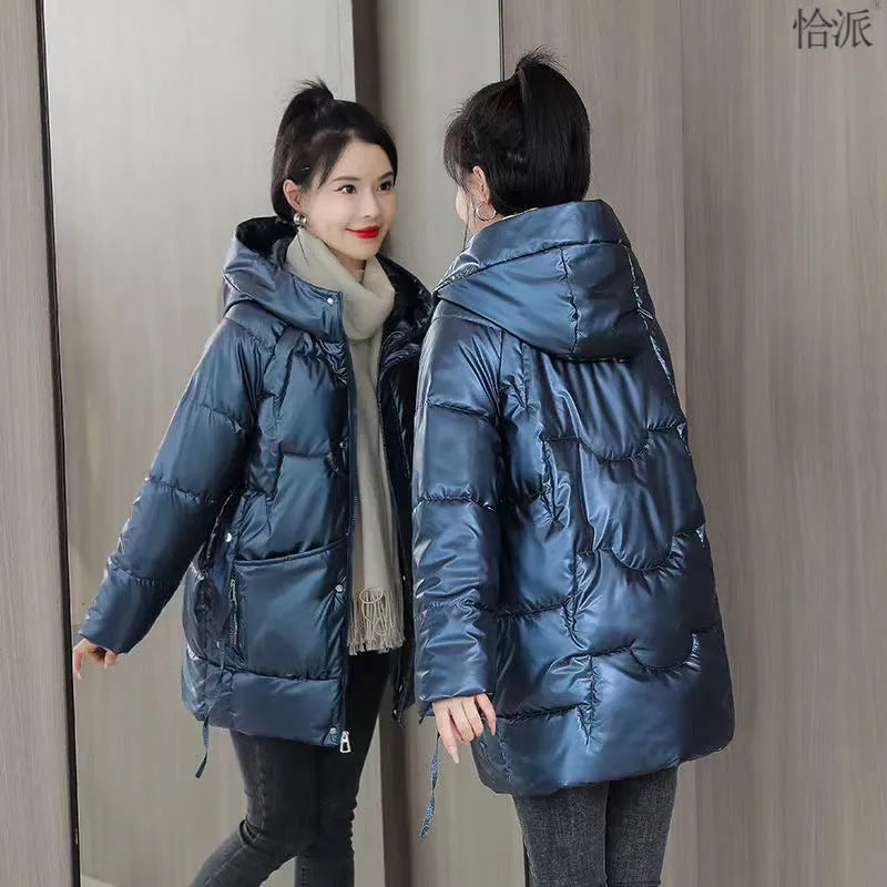 A woman's loose-fitting, thick, hooded winter jacket in a choice of colours on a size chart background.