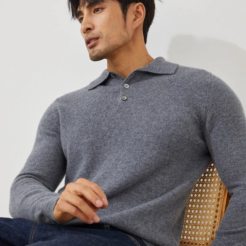 Man wearing a sapphire blue cashmere pullover sweater with a polo collar in a loose fit.