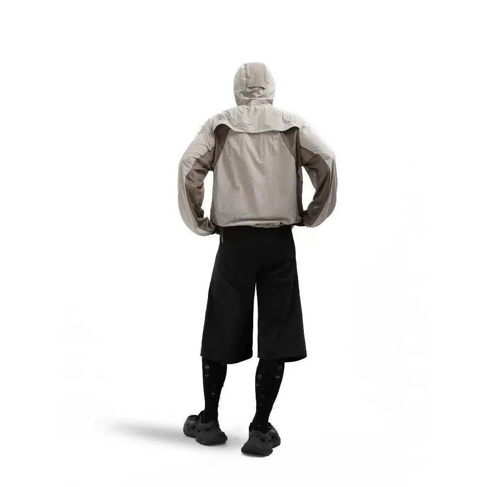Mesh stitching sun protective nylon top shown in desert brown colour on a hanger.