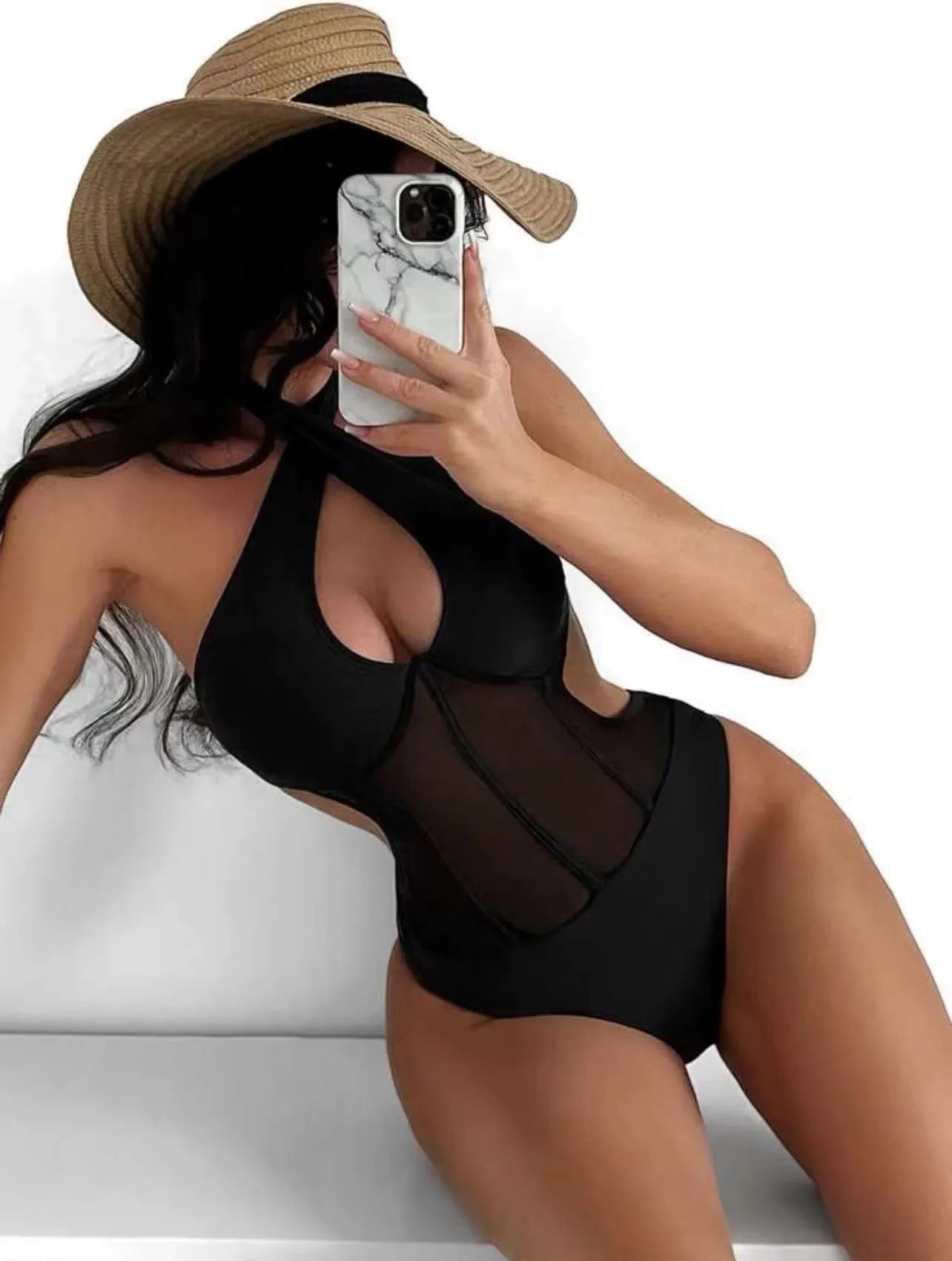 Ladies black one-piece swimsuit bikini made from nylon and spandex fabric on a mannequin.