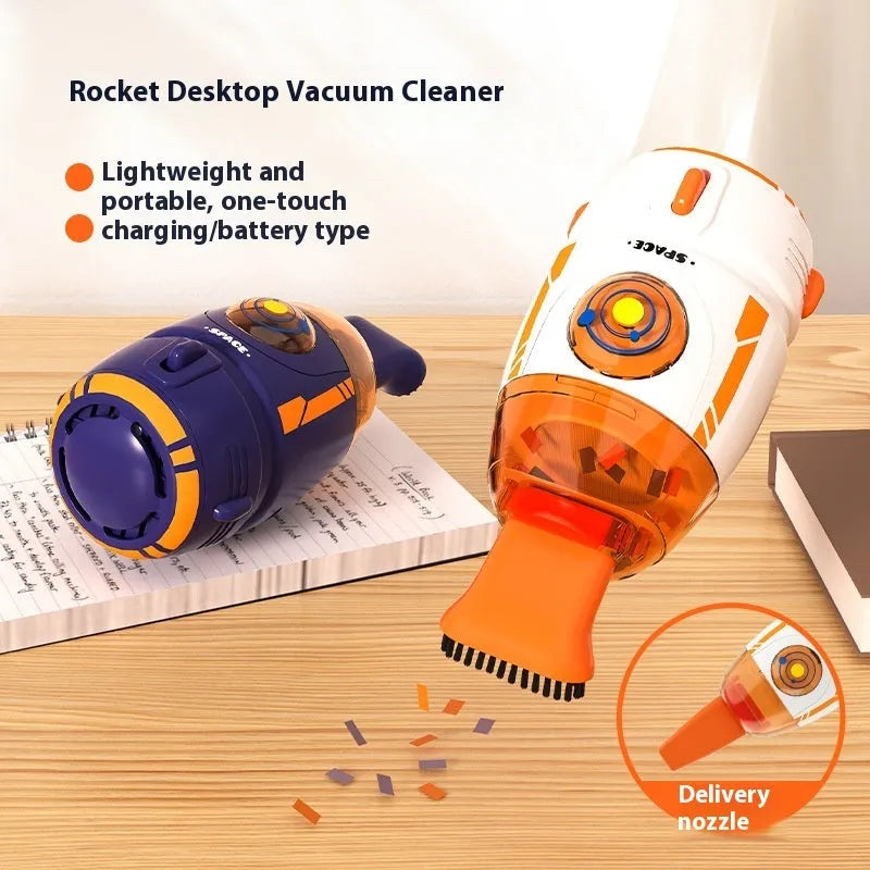 Handheld USB desktop vacuum cleaner in blue rocket design on a wooden desk.