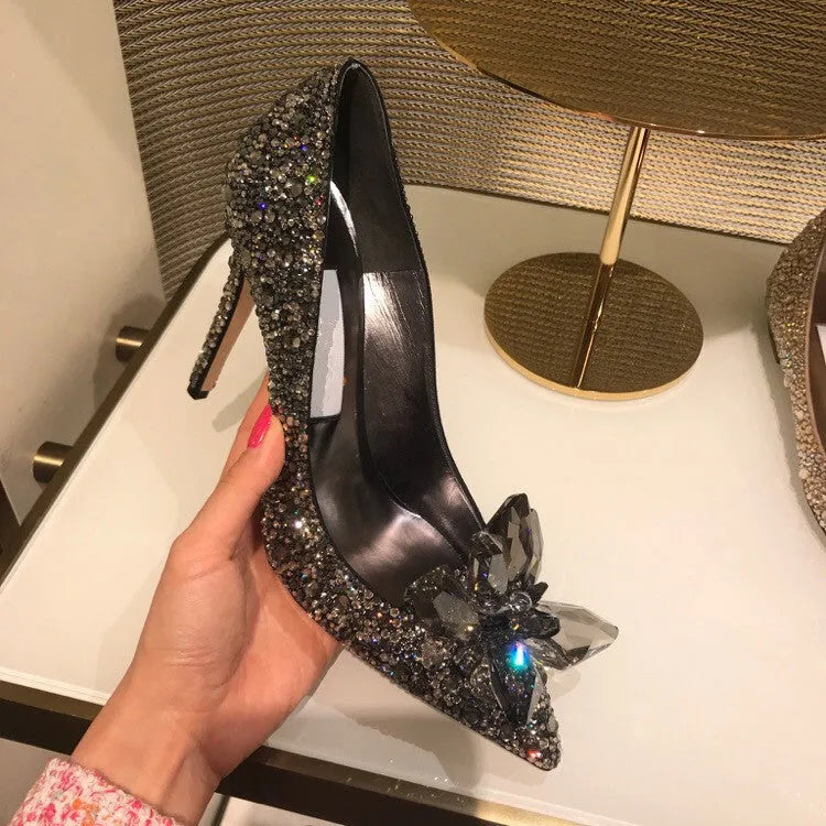 Women's gold pointed toe high heels with rhinestone details and stiletto heel