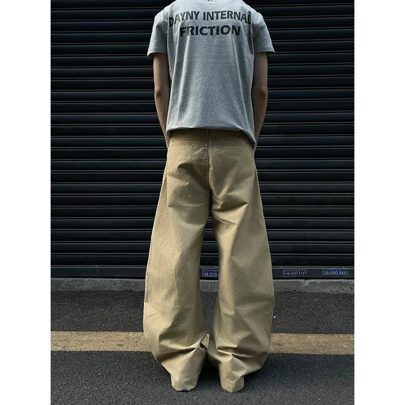 Men's straight leg khaki cotton trousers on a hanger, showing classic casual style.
