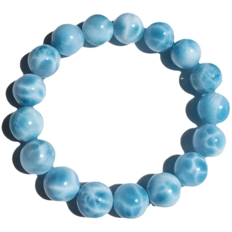 Blue Maillard style bodhi bracelet with natural crystal, sea-pattern stone, and a pearl bead.