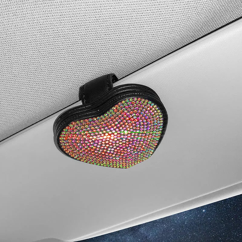 Diamond decorated PU leather magnetic clip for car sun visor holding sunglasses.