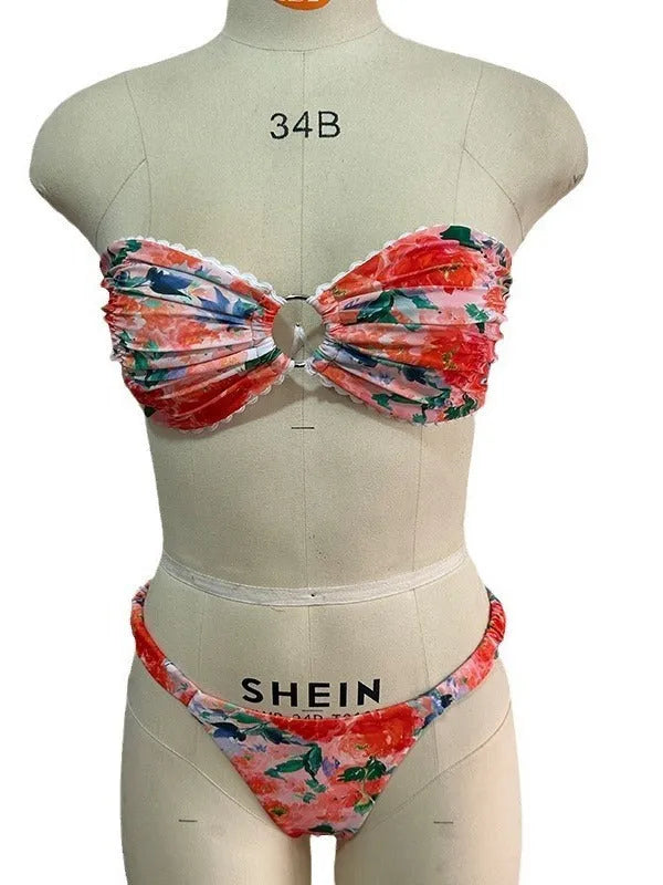 Women's floral print bikini set with lace trim on tube top and briefs in blue colour