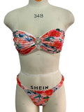 Women's floral print bikini set with lace trim on tube top and briefs in blue colour