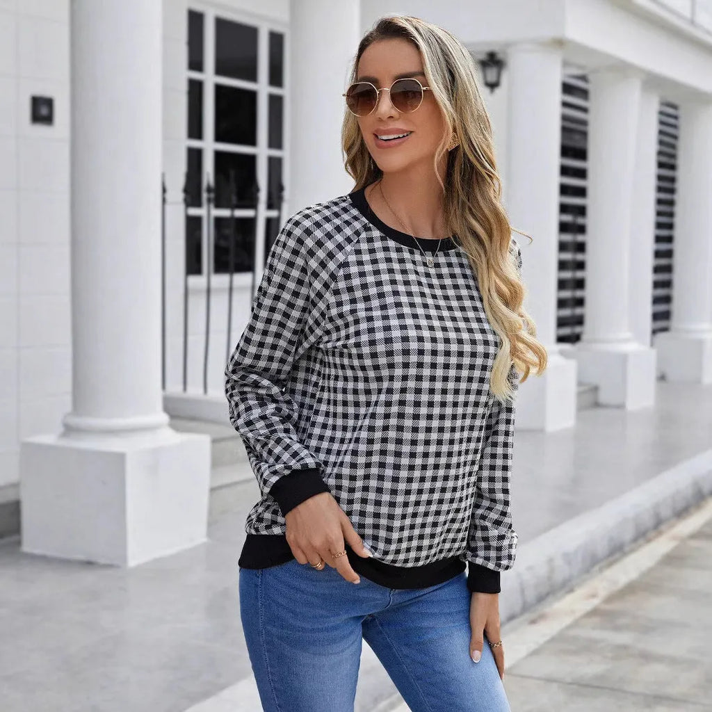 Black long sleeve pullover sweater with a Japanese sweet plaid and stripe pattern on a mannequin.